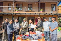 झापा सेवाकेन्द्रमा मगरद्वारा न्यानाे टोपी वितरण